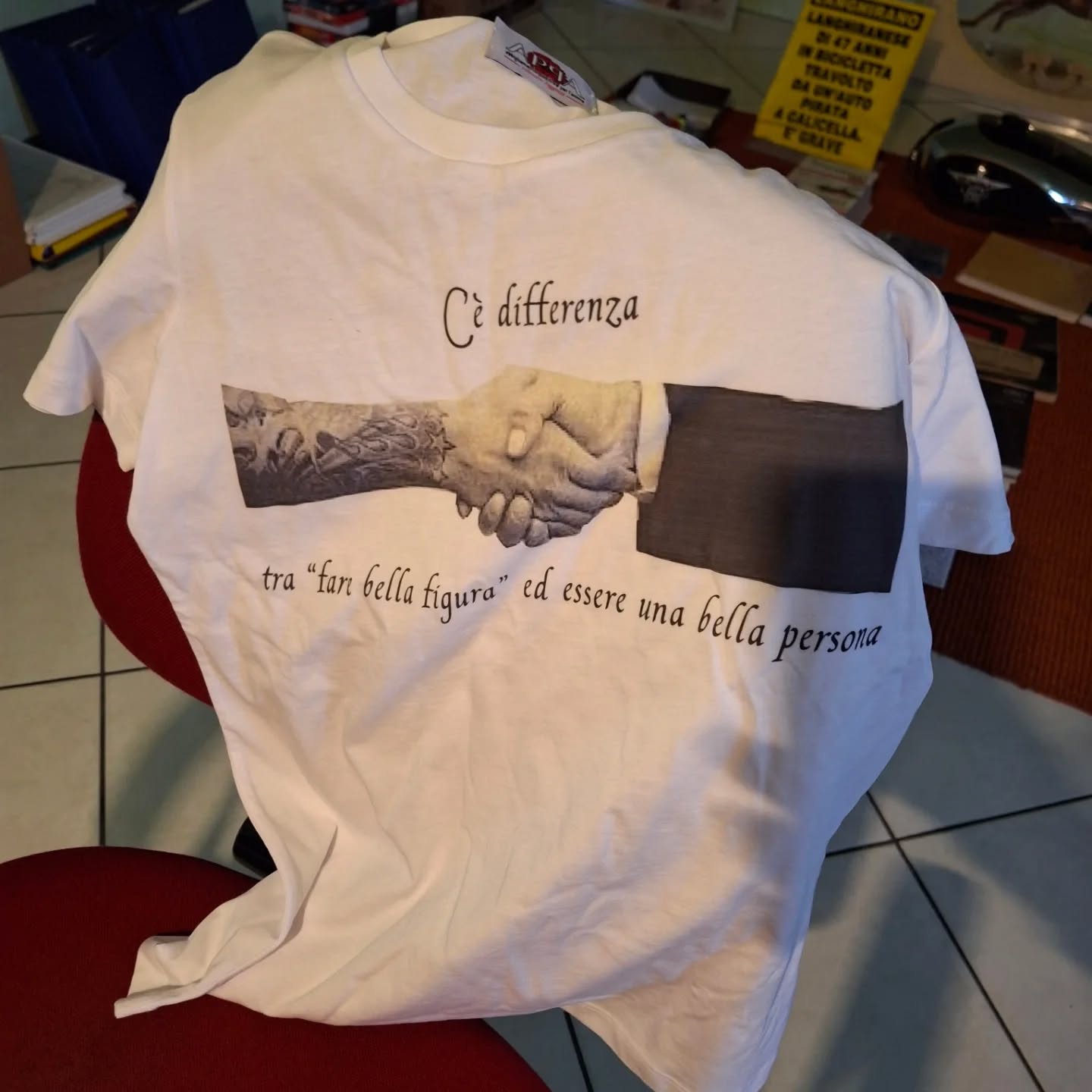 a white shirt with a hand drawn image on it